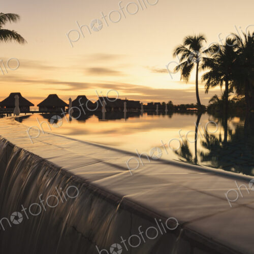 Palm trees overlooking tropical resort, Bora Bora, French Polynesia Palm trees overlooking tropical resort, Bora Bora, French Polynesia