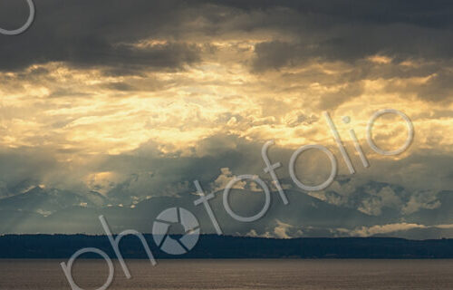 Panoramic view of Olympic Mountain range seen from across the water, Washington state,…