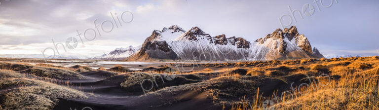 Panoramic view of mountains over remote fields