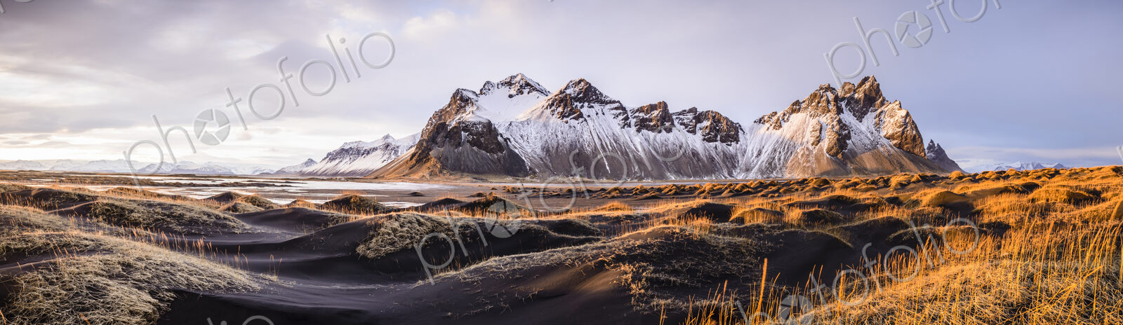 Panoramic view of mountains over remote fields