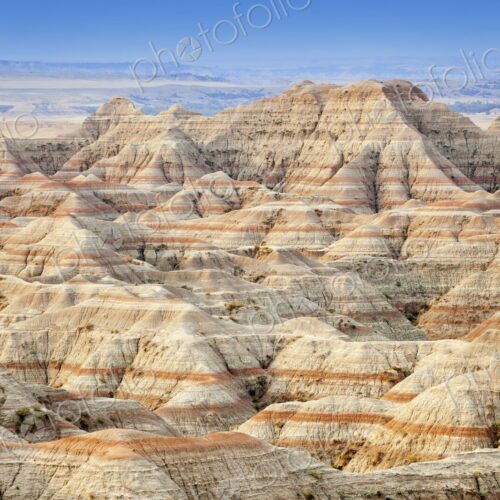 Panoramic view of striped buttes and eroded hills at a scenic overlook in Badlands…