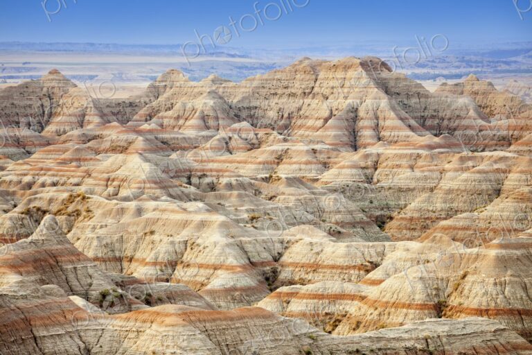 Panoramic view of striped buttes and eroded hills at a scenic overlook in Badlands…