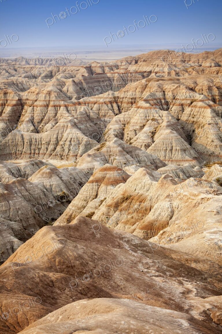 Panoramic view of striped buttes and eroded hills at a scenic overlook in Badlands…