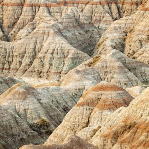Panoramic view of striped buttes and eroded hills at a scenic overlook in Badlands…
