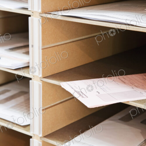 Papers in pigeon holes.