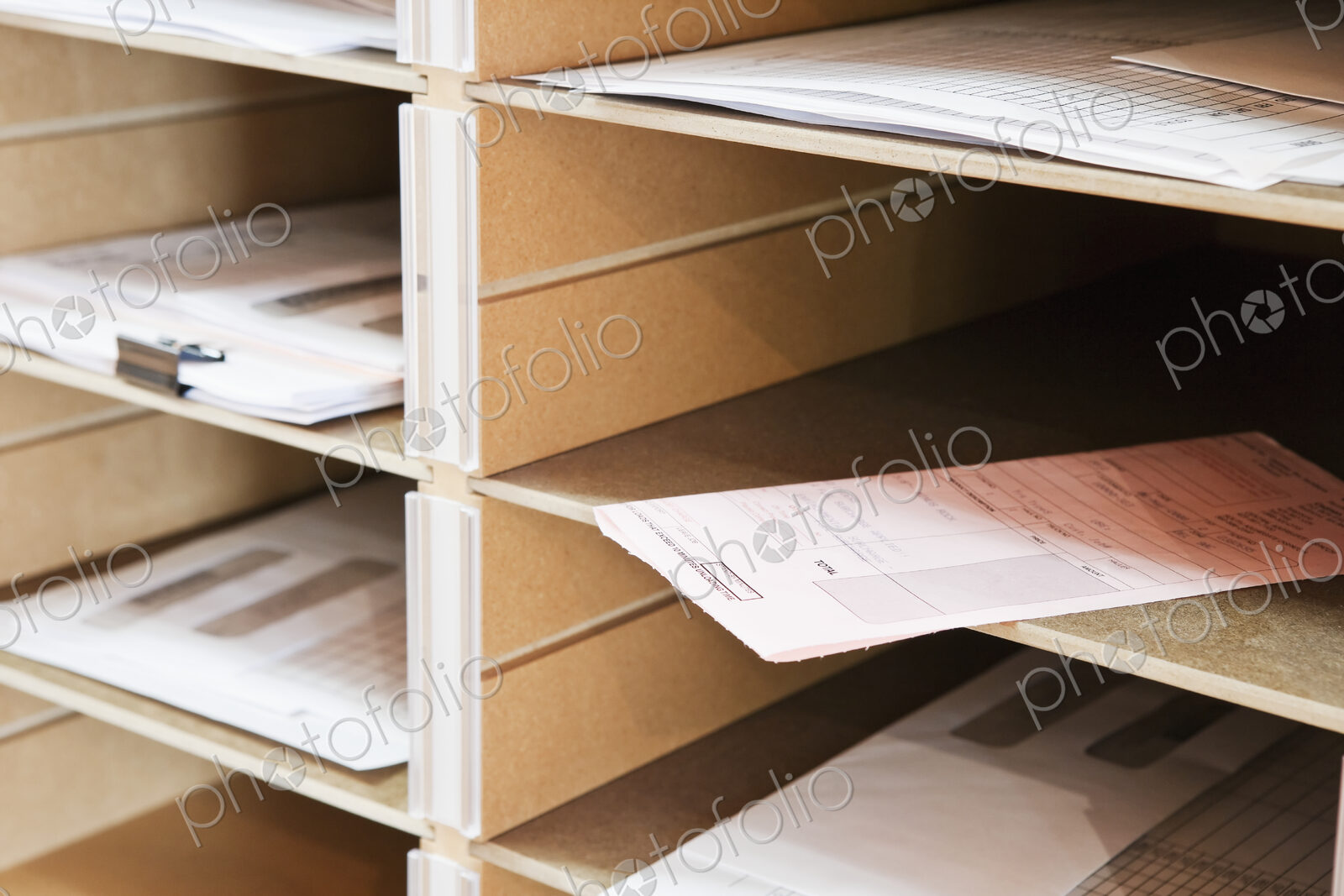 Papers in pigeon holes.