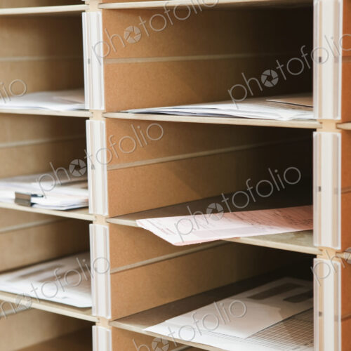 Papers in pigeon holes.