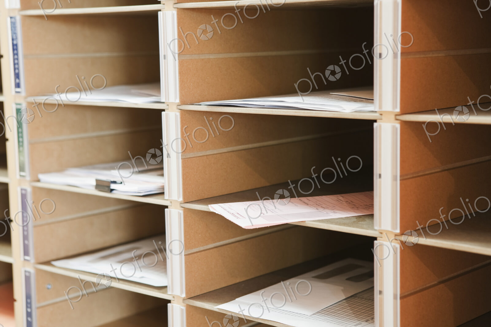 Papers in pigeon holes.