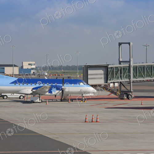 Parked Airplane at an Airport Gate Parked Airplane at an Airport Gate