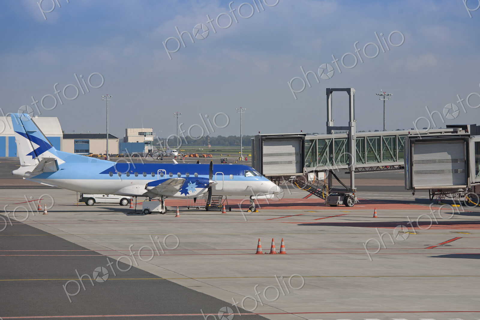 Parked Airplane at an Airport Gate
