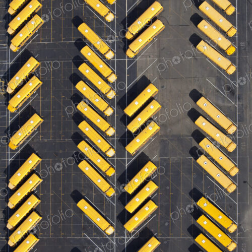 Parked School Buses In A Parking Lot Parked School Buses In A Parking Lot