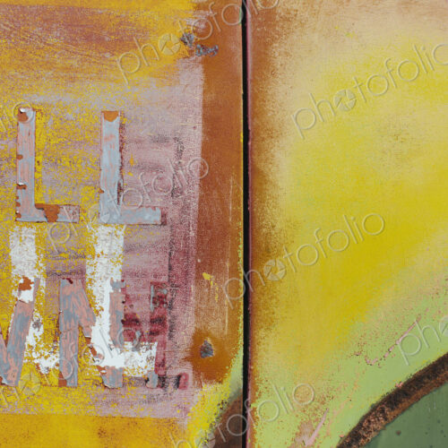 Peeling lettering and paint on side of old, abandoned truck Peeling lettering and paint on side of old, abandoned truck