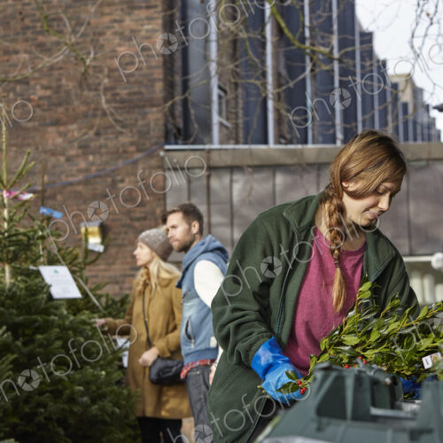 People at a garden centre shopping for a Christmas tree. People at a garden centre shopping for a Christmas tree.