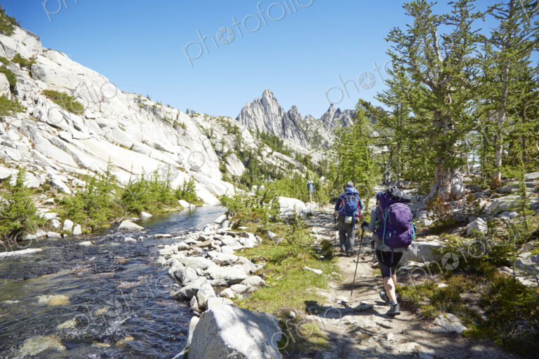 People hiking near remote river