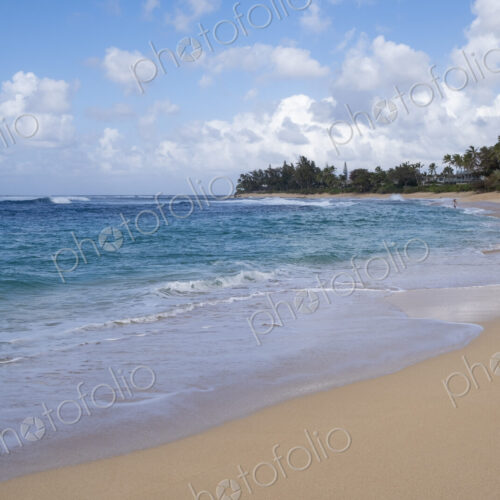 People in the distance on Waimea Bay Beach, North Shore, Oahu People in the distance on Waimea Bay Beach, North Shore, Oahu