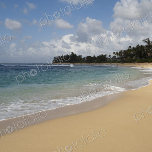 People in the distance on Waimea Bay Beach, North Shore, Oahu People in the distance on Waimea Bay Beach, North Shore, Oahu