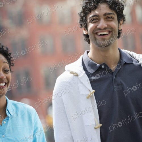People outdoors in the city in spring time. New York City park. A man and woman side… People outdoors in the city in spring time. New York City park. A man and woman side…