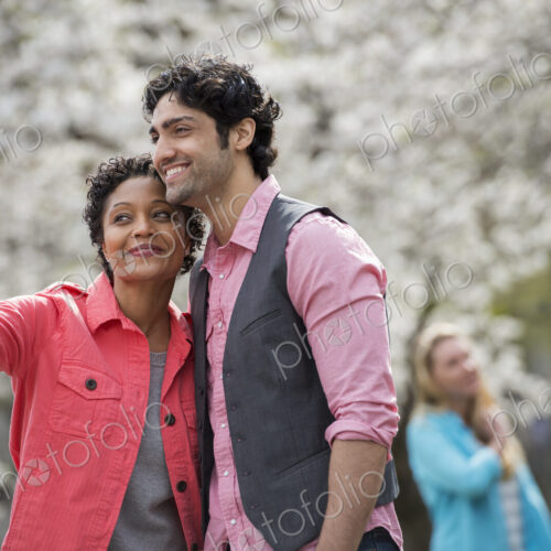 People outdoors in the city, woman taking selfie People outdoors in the city, woman taking selfie