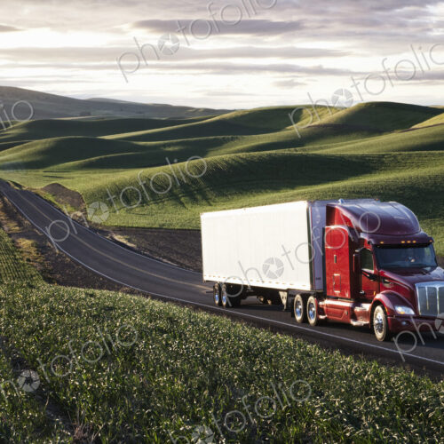 Peterbilt Class8 commercial truck driving through farmlands in eastern Washington, USA…