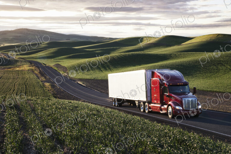 Peterbilt Class8 commercial truck driving through farmlands in eastern Washington, USA…