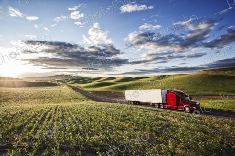 Peterbilt Class8 commercial truck driving through farmlands in eastern Washsington,…