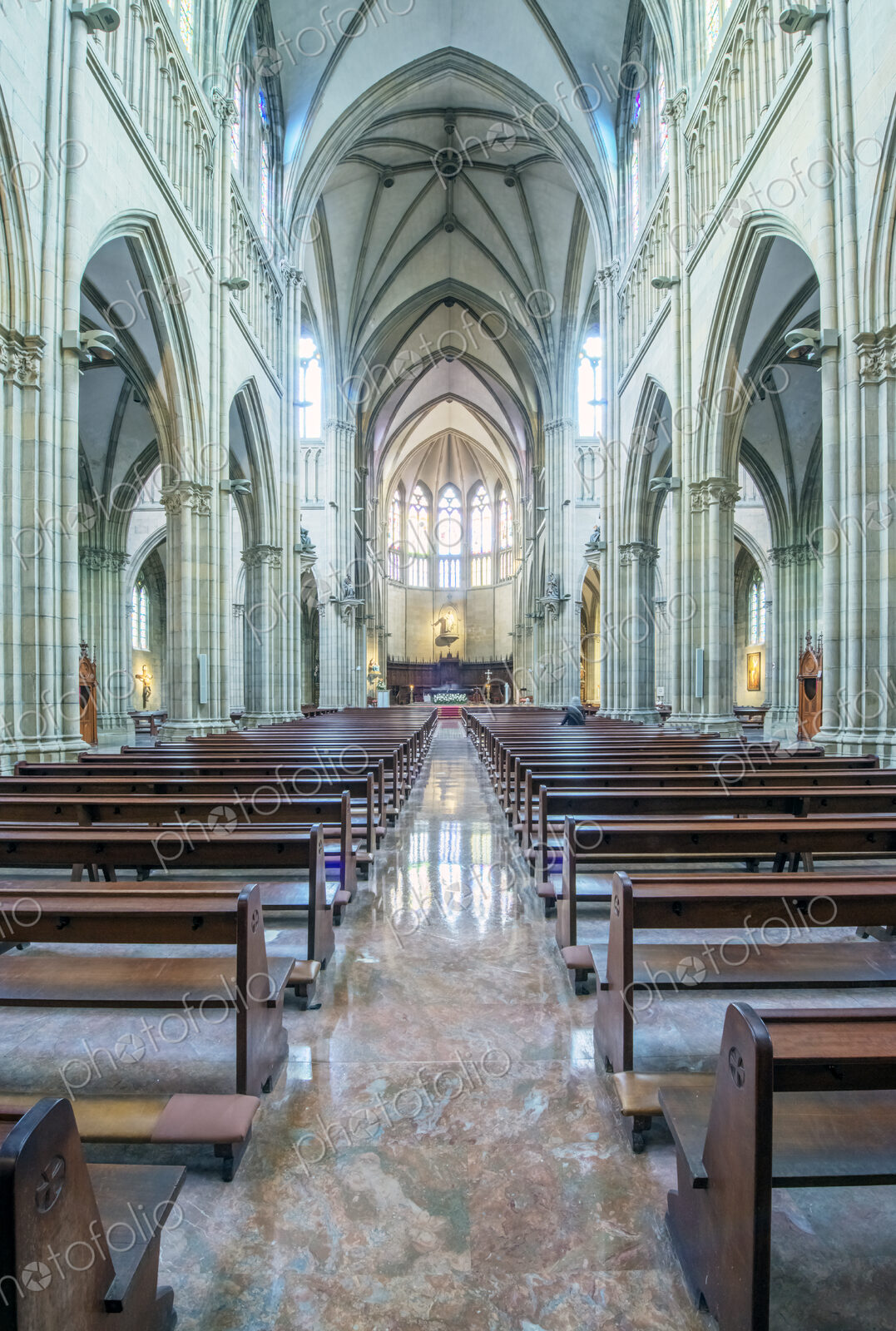 Pews and arches in ornate church