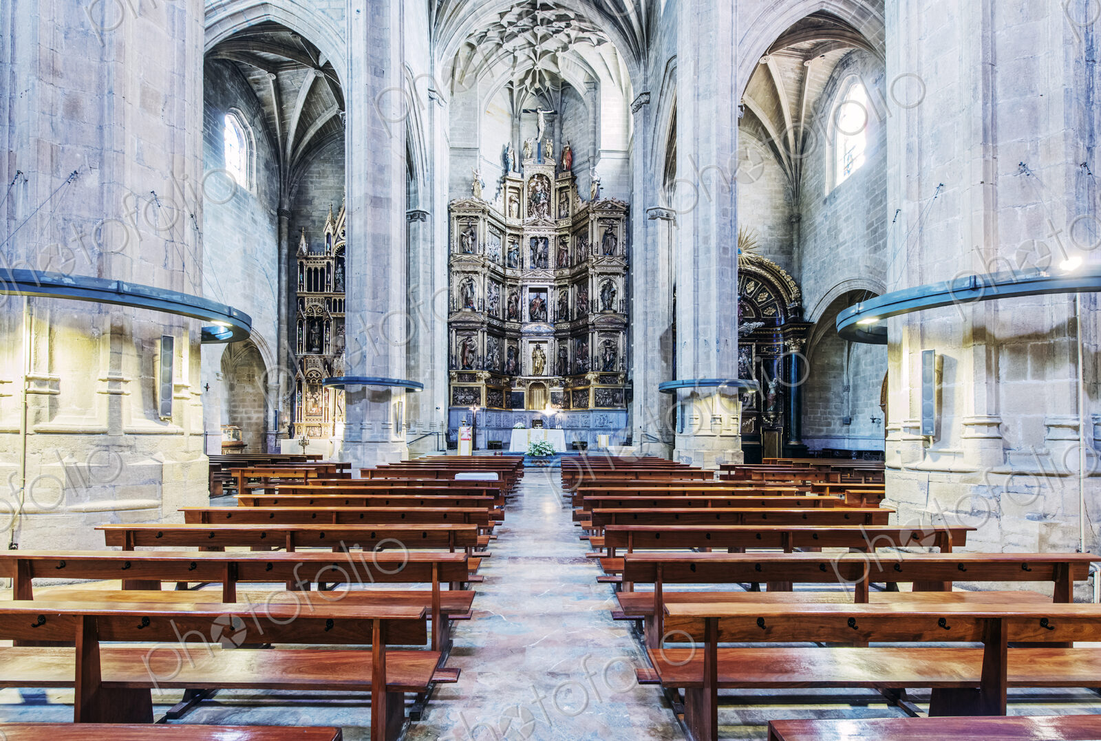 Pews and arches in ornate church