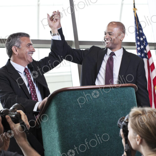Photographers taking photographs at a political gathering. Photographers taking photographs at a political gathering.
