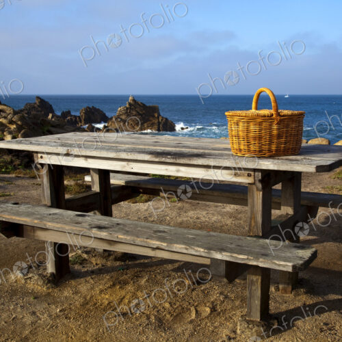 Picnic Basket on Wooden Picnic Table