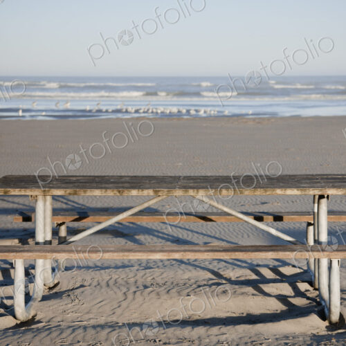 Picnic table on sandy beach. Picnic table on sandy beach.