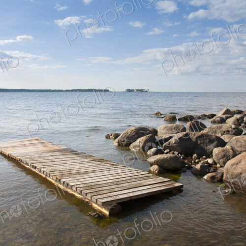 Pier Floating on a Rocky Shore Pier Floating on a Rocky Shore