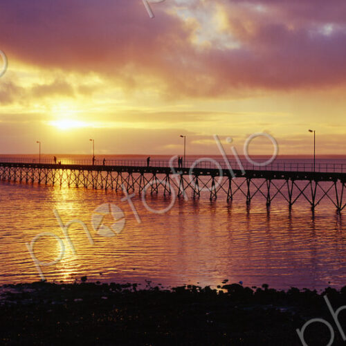 Pier in the sea with sunset on the horizon of the ocean. Pier in the sea with sunset on the horizon of the ocean.