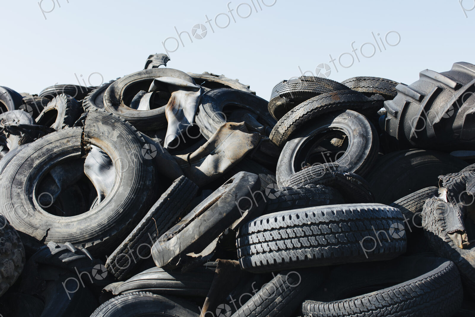 Pile of discarded auto and tractor tires in rural landfil, near Kildeer, Saskatchewan,…
