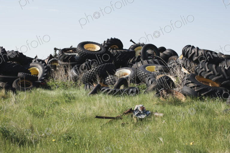 Pile of discarded auto and tractor tires in rural landfill, near Kildeer,…