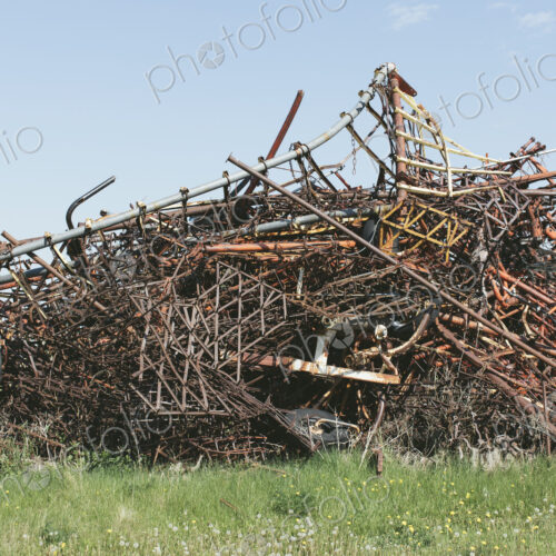 Pile of discarded farming equipment in rural landfill, near Kildeer, Saskatchewan, Canada. Pile of discarded farming equipment in rural landfill, near Kildeer, Saskatchewan, Canada.