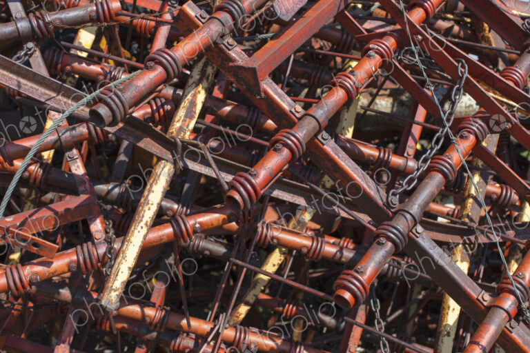 Pile of discarded farming equipment in rural landfill, near Kildeer, Saskatchewan, Canada.