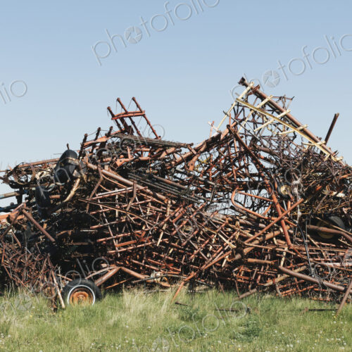 Pile of discarded farming equipment in rural landfill, near Kildeer, Saskatchewan, Canada. Pile of discarded farming equipment in rural landfill, near Kildeer, Saskatchewan, Canada.