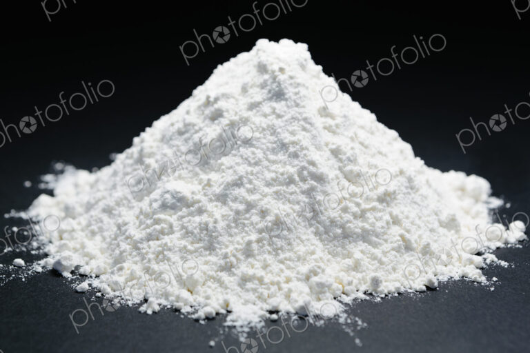 Pile of organic unbleached white flour, black backdrop
