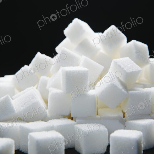 Pile of sugar cubes, black backdrop Pile of sugar cubes, black backdrop