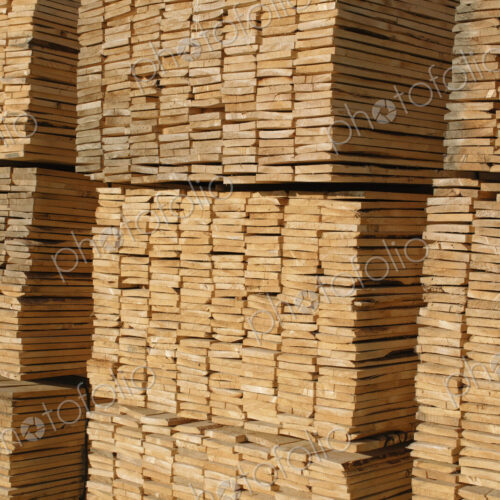 Piles of cut lumber in a timber yard Piles of cut lumber in a timber yard