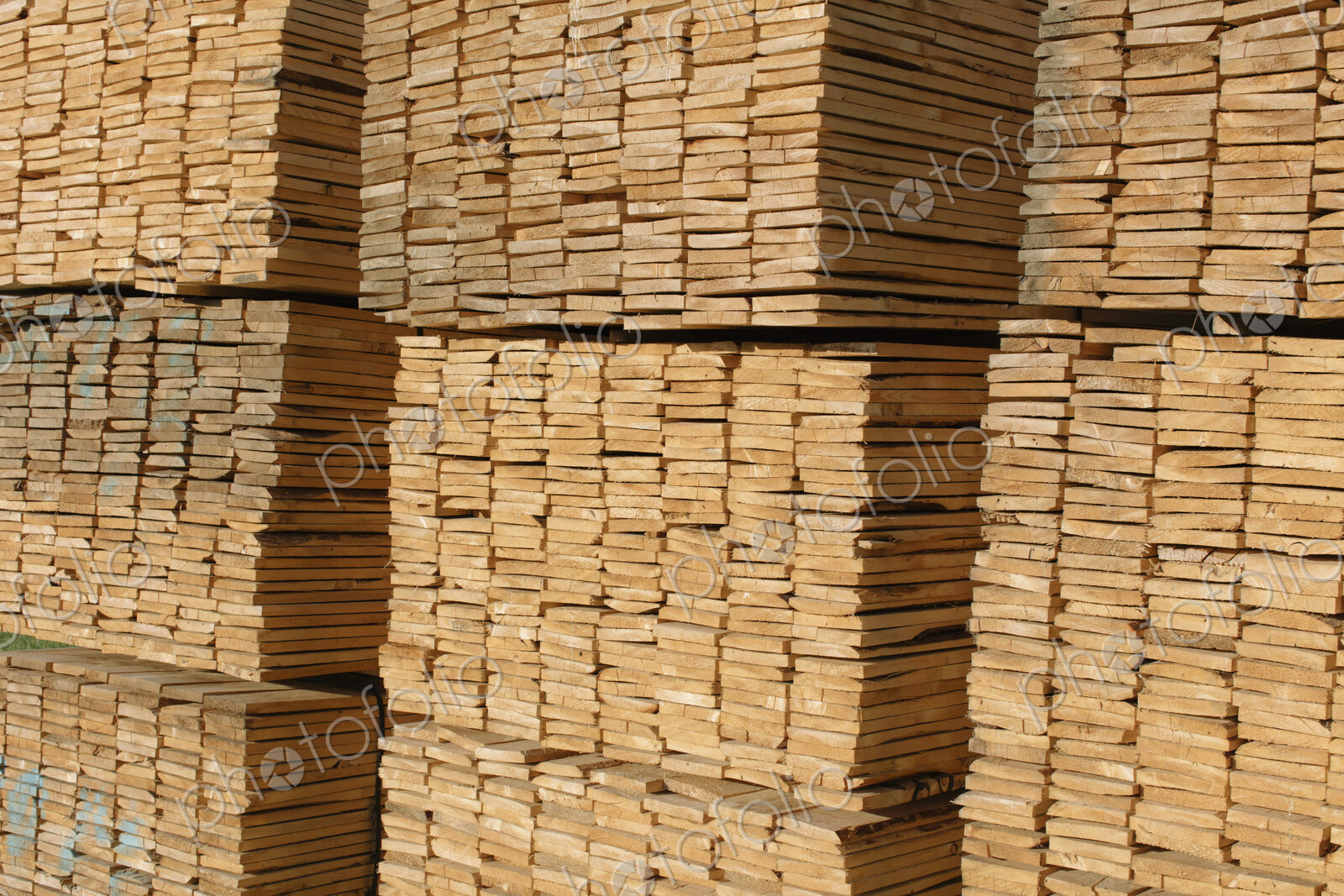 Piles of cut lumber in a timber yard