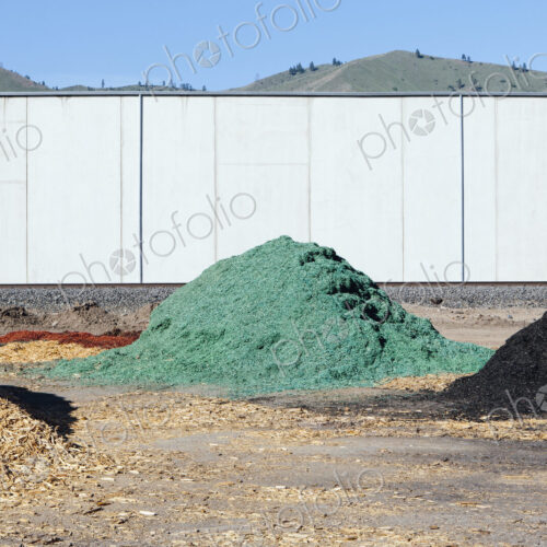 Piles of green bark wood chips used for landscaping, near Quincy Piles of green bark wood chips used for landscaping, near Quincy