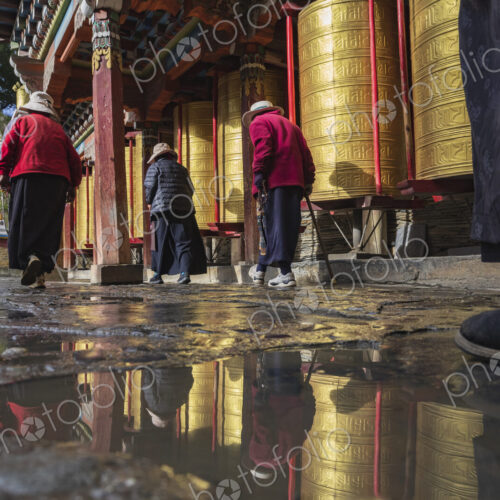 Pilgrims walking around Prayer Wheels Tagong, Sichuan Province, Kham Tibet, Pilgrims walking around Prayer Wheels Tagong, Sichuan Province, Kham Tibet,