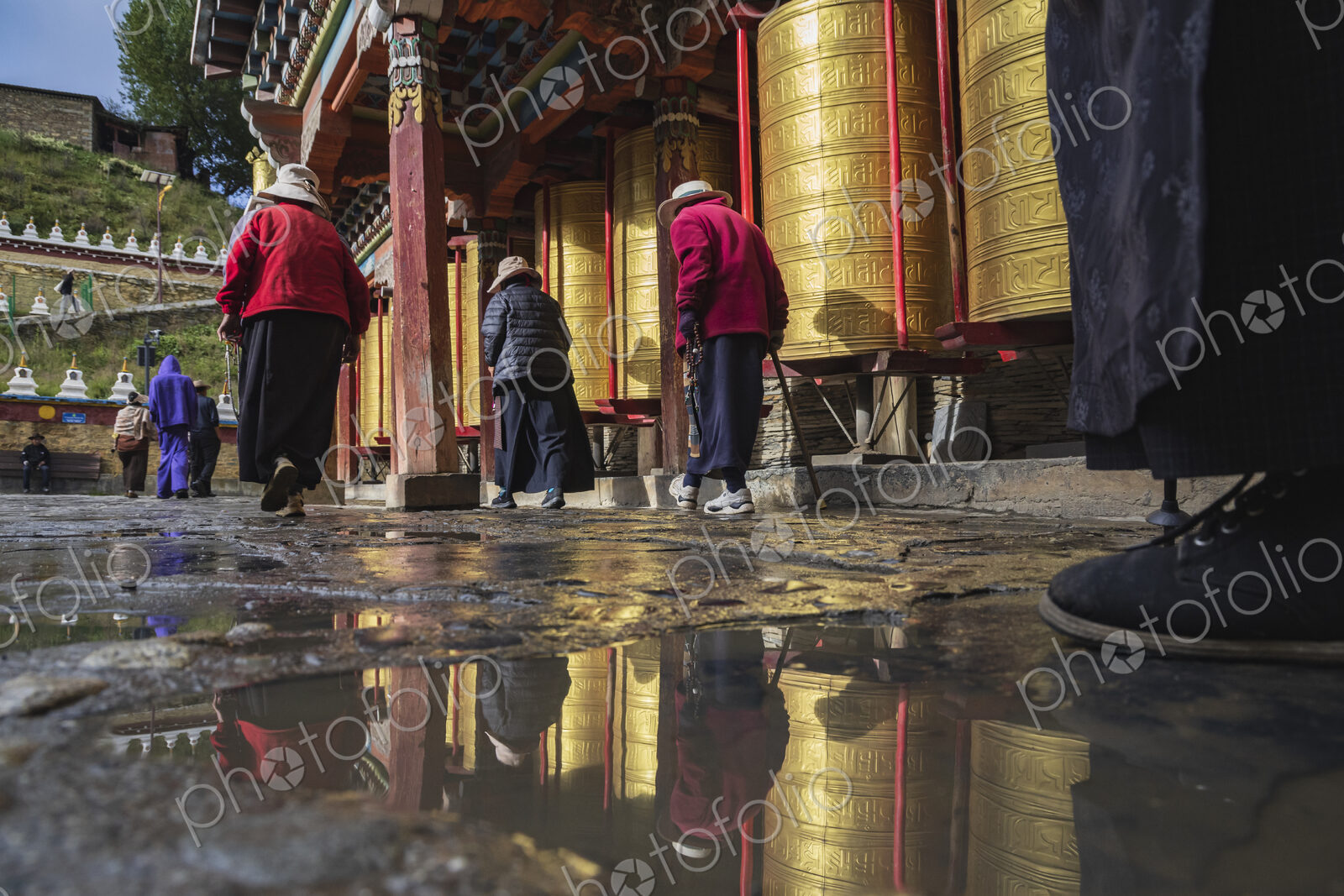 Pilgrims walking around Prayer Wheels Tagong, Sichuan Province, Kham Tibet,