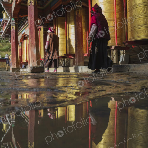 Pilgrims walking around Prayer Wheels Tagong, Sichuan Province, Kham Tibet, Pilgrims walking around Prayer Wheels Tagong, Sichuan Province, Kham Tibet,