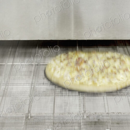 Pizza Coming Out of the Oven Pizza Coming Out of the Oven