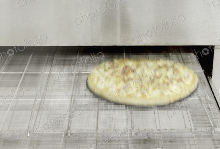 Pizza Coming Out of the Oven