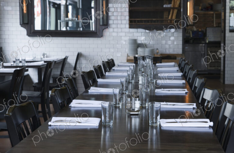 Place settings at table in empty restaurant