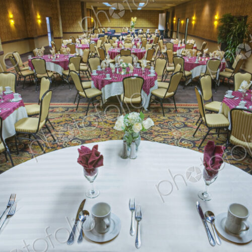 Place settings on tables in banquet room