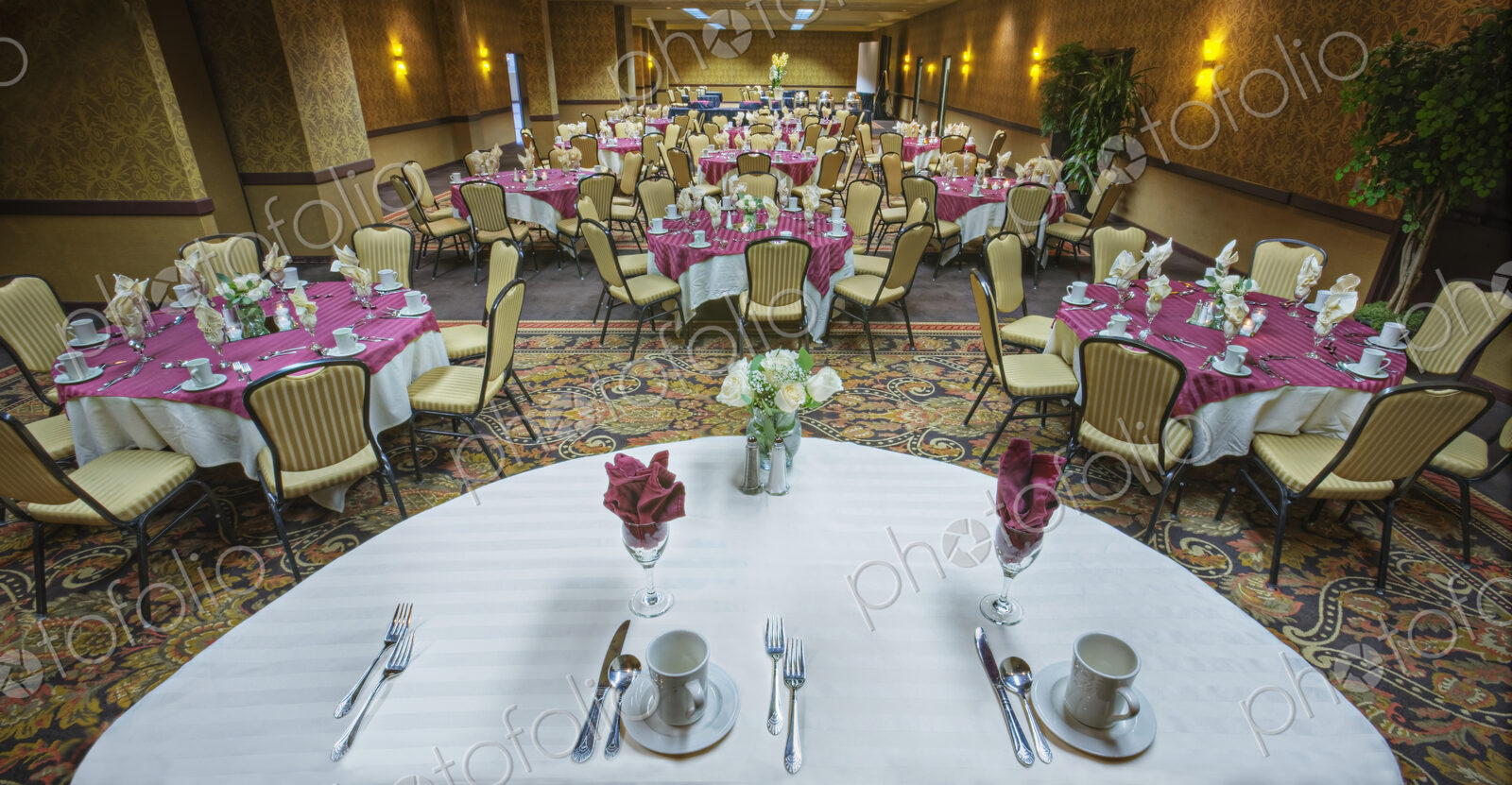 Place settings on tables in banquet room